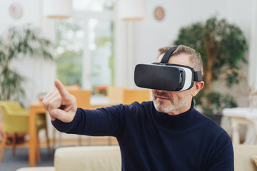 Man in 3D glasses clicking on object