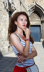 Portrait of woman walking outside on the city street.Female tourist walking outdoors.