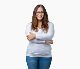 Beautiful plus size young woman over isolated background happy face smiling with crossed arms looking at the camera. Positive person.