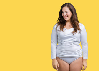 Obraz premium Beautiful plus size young overwight woman wearing white underwear over isolated background looking away to side with smile on face, natural expression. Laughing confident.
