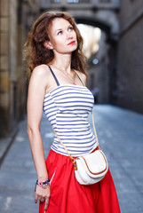 Portrait of woman walking outside on the city street.Female tourist walking outdoors.