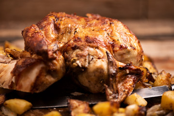  Whole roasted chicken on a cutting board
