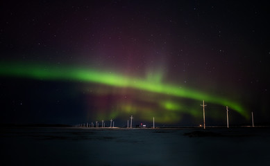 Colorful northern lights over a saskatchewan prairies winter landscape at night
