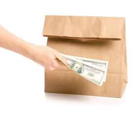 Package bag delivery money dollars in hand on white background isolation