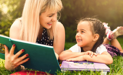 Mother and daughter reading a book