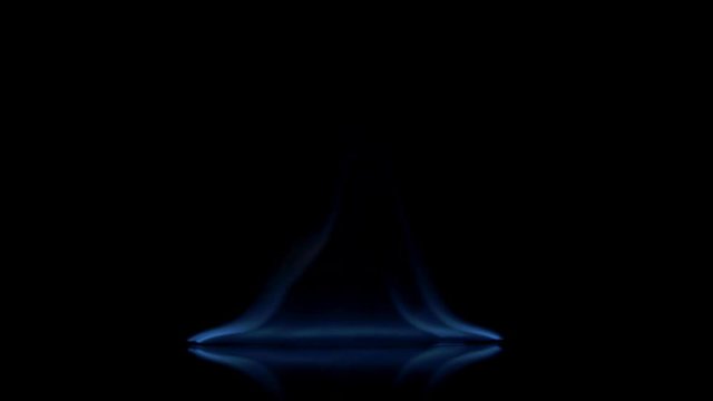 Flames burn on the mirror surface on a black background
