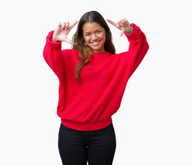 Young beautiful brunette woman wearing red winter sweater over isolated background Smiling doing frame using hands palms and fingers, camera perspective