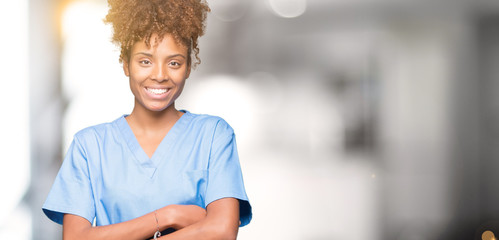 Young african american doctor woman over isolated background happy face smiling with crossed arms...