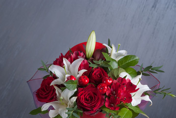 Bouquet of colored flowers in Valentine's day. Red roses. Present for girls and woman