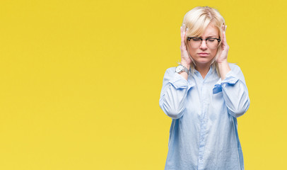 Young beautiful blonde business woman wearing glasses over isolated background with hand on head for pain in head because stress. Suffering migraine.