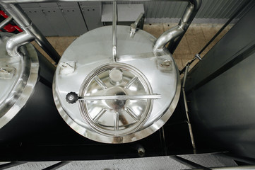 Modern brewery and equipment machinery tools for alcohol production. Steel vats or tanks and...