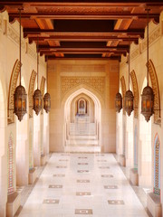 example of islamic architecture with wooden wainscoting and marble floor, mosque in Muscat, Oman,...