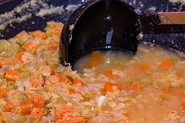 Scotch broth cooking on the hob