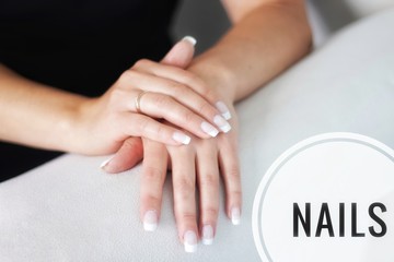Obraz na płótnie Canvas Advertising nail gel polish. Text Nails on the photo. Advertising banner nails