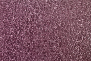 Textured glass with a color tint.