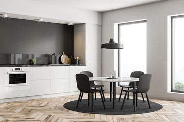 White and black kitchen corner with table