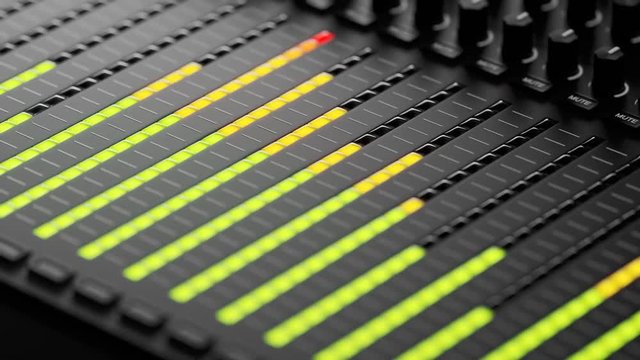 Colorful led lights indicating sound volume levels on a studio mixer. 4KHD
