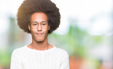 Young african american man with afro hair wearing glasses Smiling with hands palms together receiving or giving gesture. Hold and protection