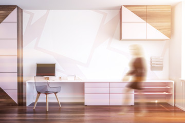 Pink and wooden home office interior, woman