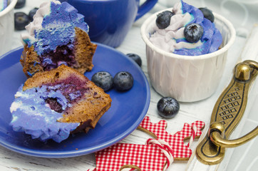Christmas cupcakes - homemade cupcakes with cacao, blueberry jam and ricotta cream decorated. Sugar free, gluten free pastry. Healthy pastry dessert.
