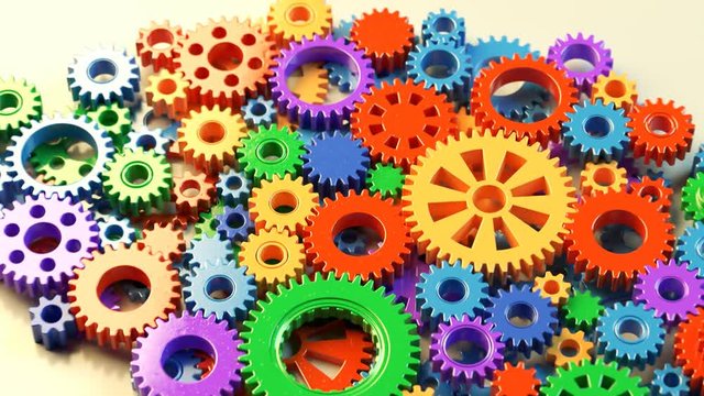 Colorful Plastic Gears Forming a Brain Shape Thinking Concept