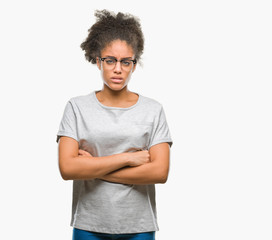 Young afro american woman wearing glasses over isolated background skeptic and nervous,...