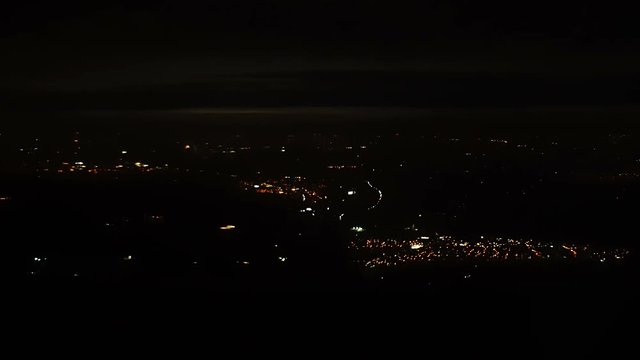 4K footage arial view of flying airlpane through the night light city scene London