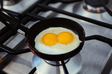 fried egg with double egg yolk in a pan
