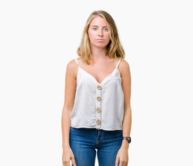 Obraz premium Beautiful young woman over isolated background with serious expression on face. Simple and natural looking at the camera.