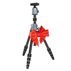 Tripod for camera or camcorder with ribbon and bow, gift concept. 3D rendering