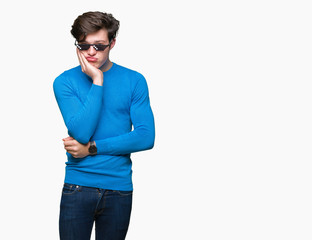 Young man wearing funny thug life glasses over isolated background thinking looking tired and bored...