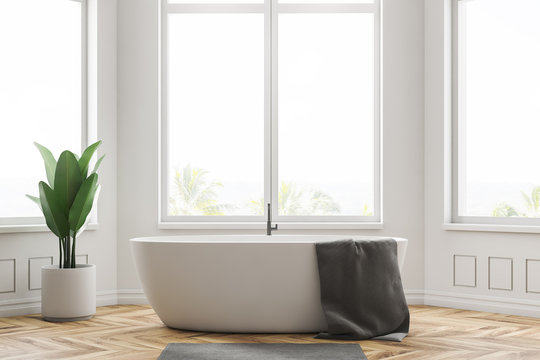 Minimalistic white bathroom interior, tub