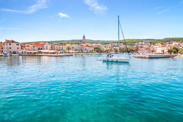 The Supetar harbor at sunny day on the Brac island, Croatia, Europe.