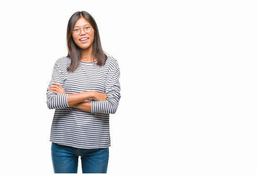 Young asian woman wearing glasses over isolated background happy face smiling with crossed arms looking at the camera. Positive person.
