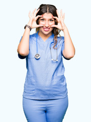 Young adult doctor woman wearing medical uniform Trying to open eyes with fingers, sleepy and tired for morning fatigue