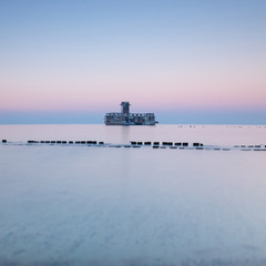 Old torpedo launcher and breakwater near Gdynia, Poland