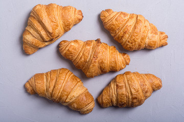 Croissants on wooden background