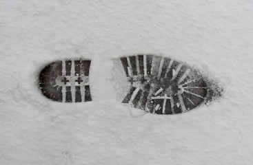 footprint in the snow - sole of a shoe