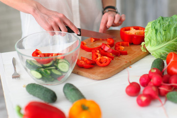 Young Woman Cooking. Healthy Food - Vegetable Salad. Diet. Healthy Lifestyle. Cooking At Home. Prepare Food