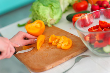 Young Woman Cooking. Healthy Food - Vegetable Salad. Diet. Healthy Lifestyle. Cooking At Home. Prepare Food