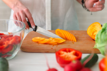 Young Woman Cooking. Healthy Food - Vegetable Salad. Diet. Healthy Lifestyle. Cooking At Home. Prepare Food
