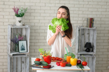 Young Woman Cooking. Healthy Food - Vegetable Salad. Diet. Healthy Lifestyle. Cooking At Home. Prepare Food
