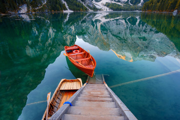 Beautiful Braies lake in boat and house in the background of Seekofel mountain  ( Pragser Wildsee )