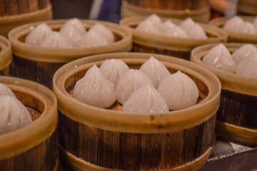 Chinese pork dumplings in a bamboo steamer at a Beijing market