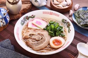 Traditional Japanese ramen withmiso based soup, sliced pork, sliced egg and green onion 