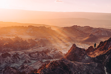 atacama desert hike peak sunset rays Chile