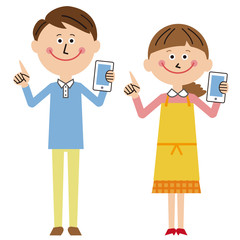 ポップな夫婦　携帯電話をもって指差し