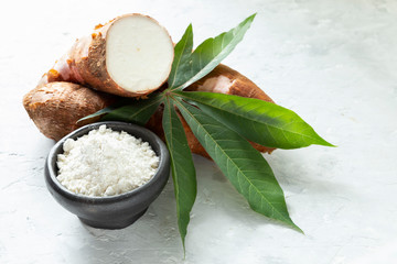 Raw yucca starch on the wooden table - Manihot esculenta.