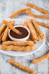 Traditional Spanish dessert churros with chocolate
