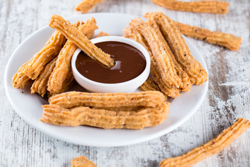 Traditional Spanish dessert churros with chocolate